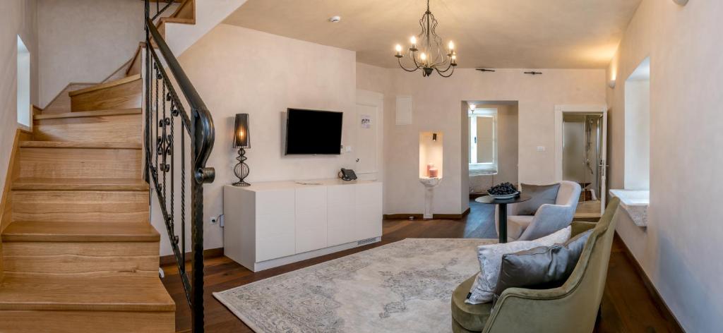 TV a/nebo společenská místnost v ubytování Puteus Palace Heritage Hotel