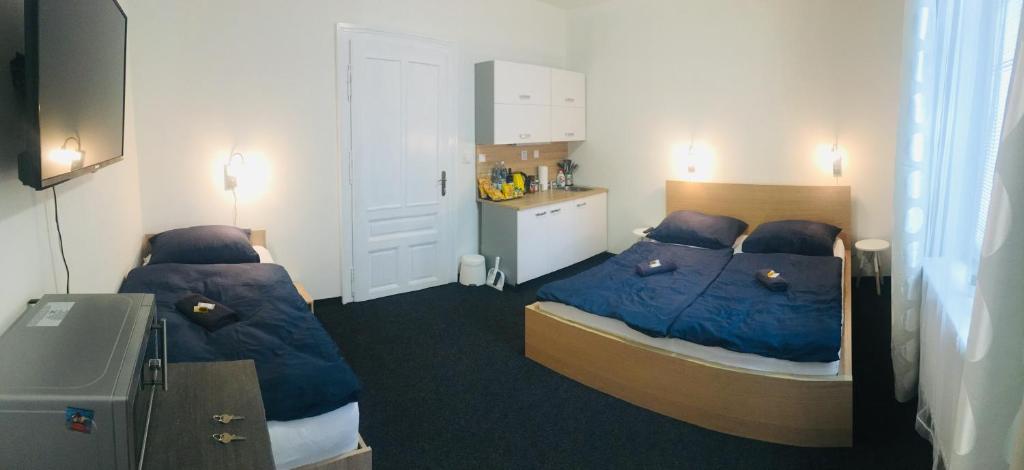 Postel nebo postele na pokoji v ubytování APARTHOTEL VÍTKOVICE