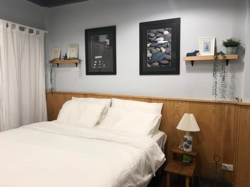 Ein Bett oder Betten in einem Zimmer der Unterkunft P.O.E Posh Homestay