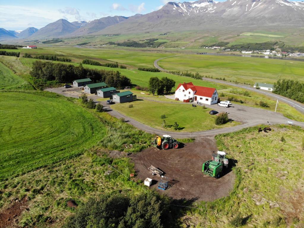 an aerial view of a farm with a red roof at Silva Holiday Home in Eyjafjaroarsveit