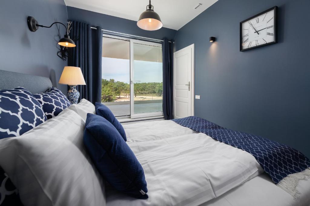 a bedroom with a large bed and a window at Hothel in Hel