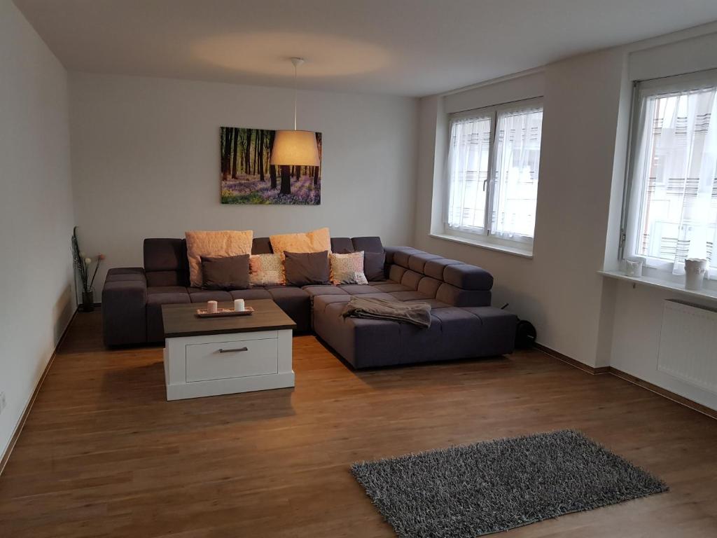 a living room with a couch and a table at Wiesenblume in Schönau im Schwarzwald