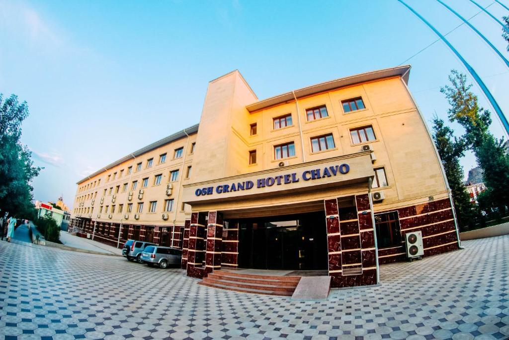 a building with a sign that reads notland hotel clamber at Osh Grand Hotel Chavo in Osh