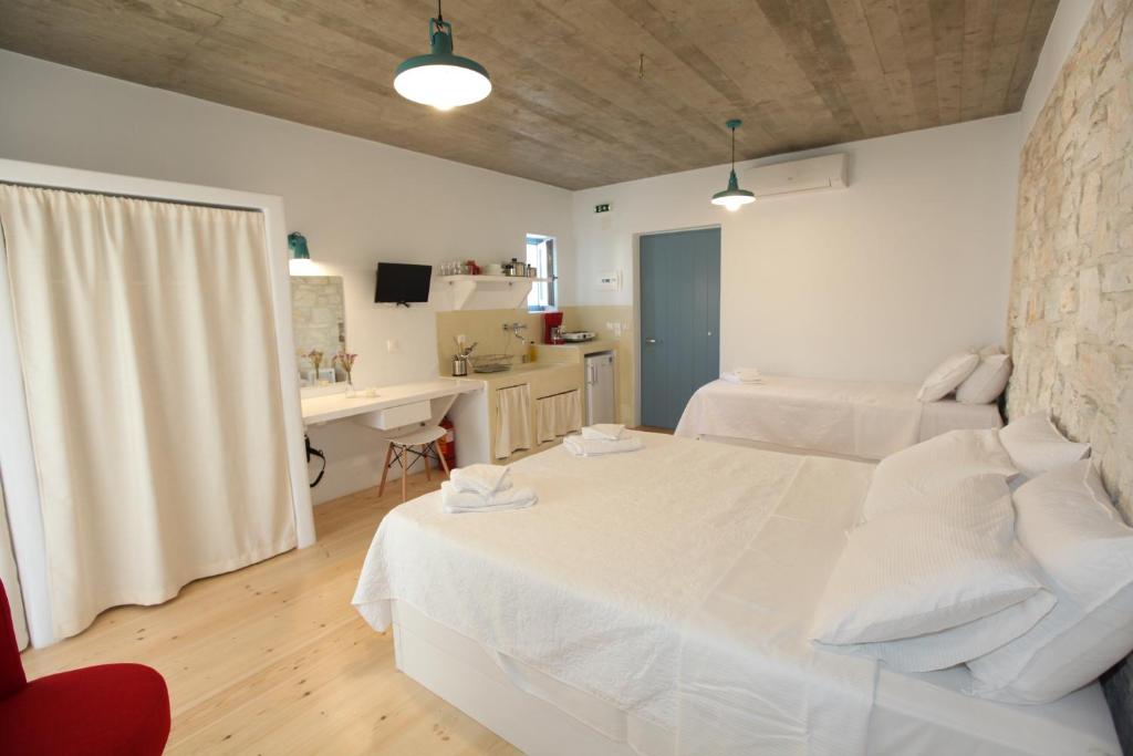 Postel nebo postele na pokoji v ubytování Nomads House