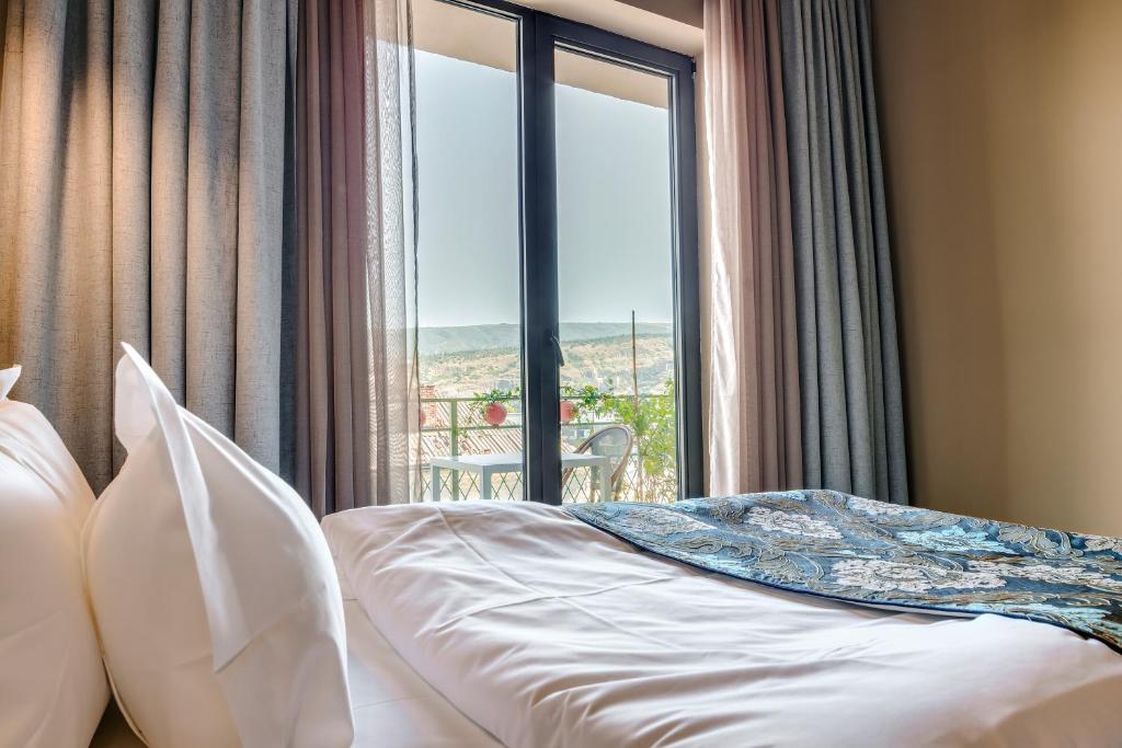 Postel nebo postele na pokoji v ubytování Brim Hotel