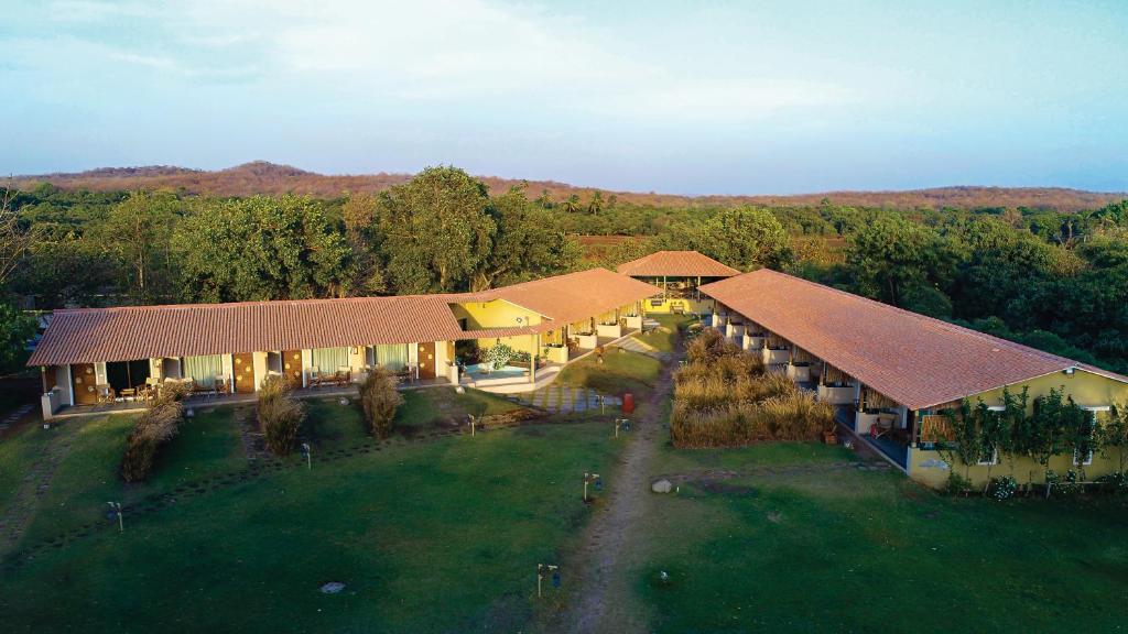 an aerial view of a building with a yard at Asiatic Lion Lodge in Sasan Gir