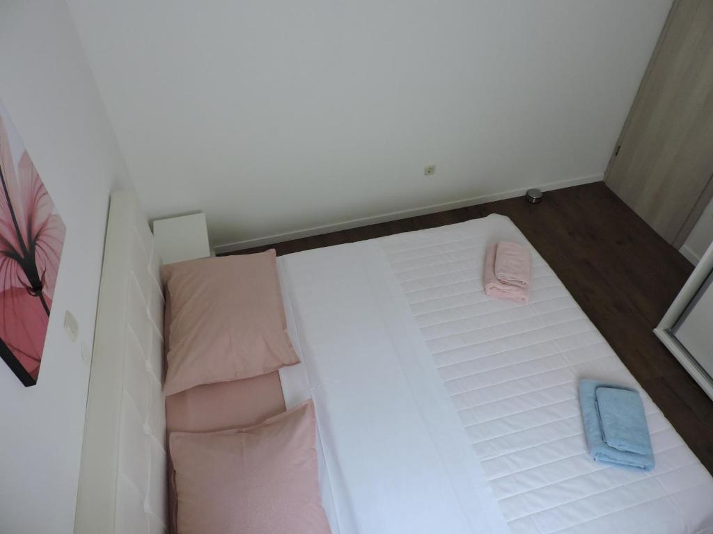Postel nebo postele na pokoji v ubytování Apartments Lidus
