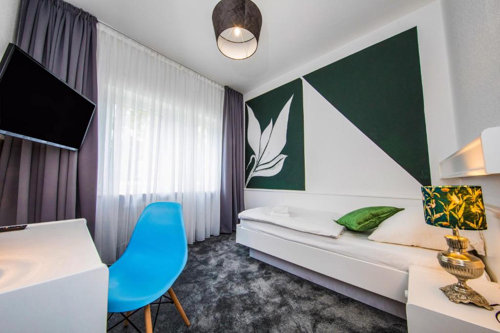 Postel nebo postele na pokoji v ubytování Kleines Hotel Heimfeld