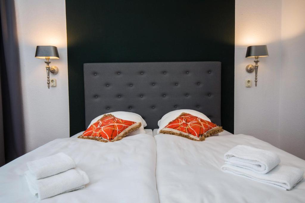 Postel nebo postele na pokoji v ubytování Kleines Hotel Heimfeld