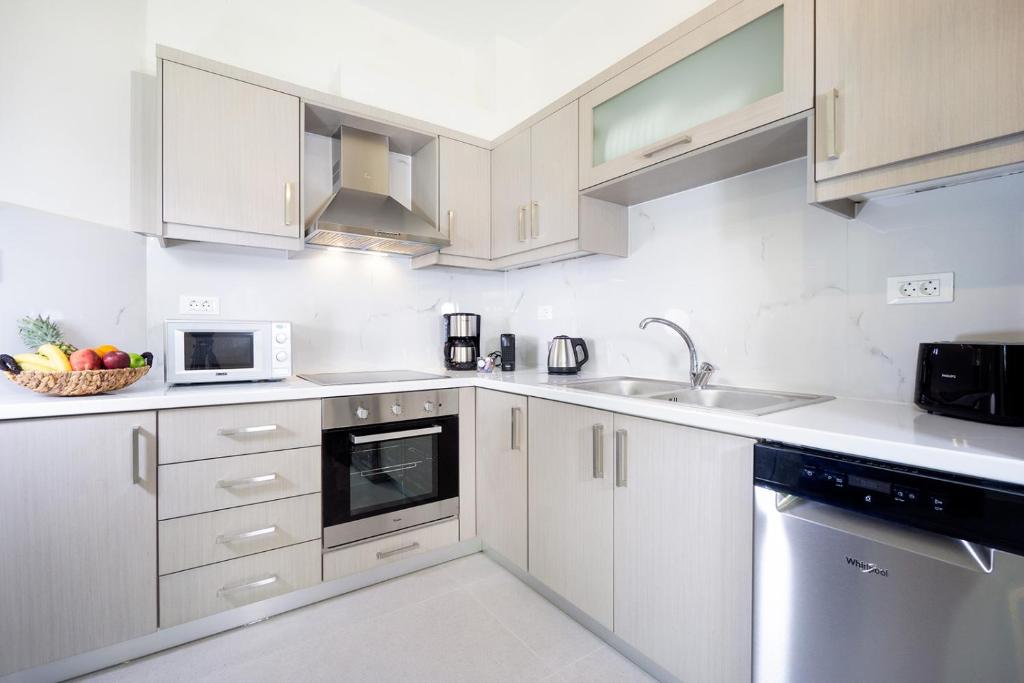Kuchyň nebo kuchyňský kout v ubytování Ariadne Apartment
