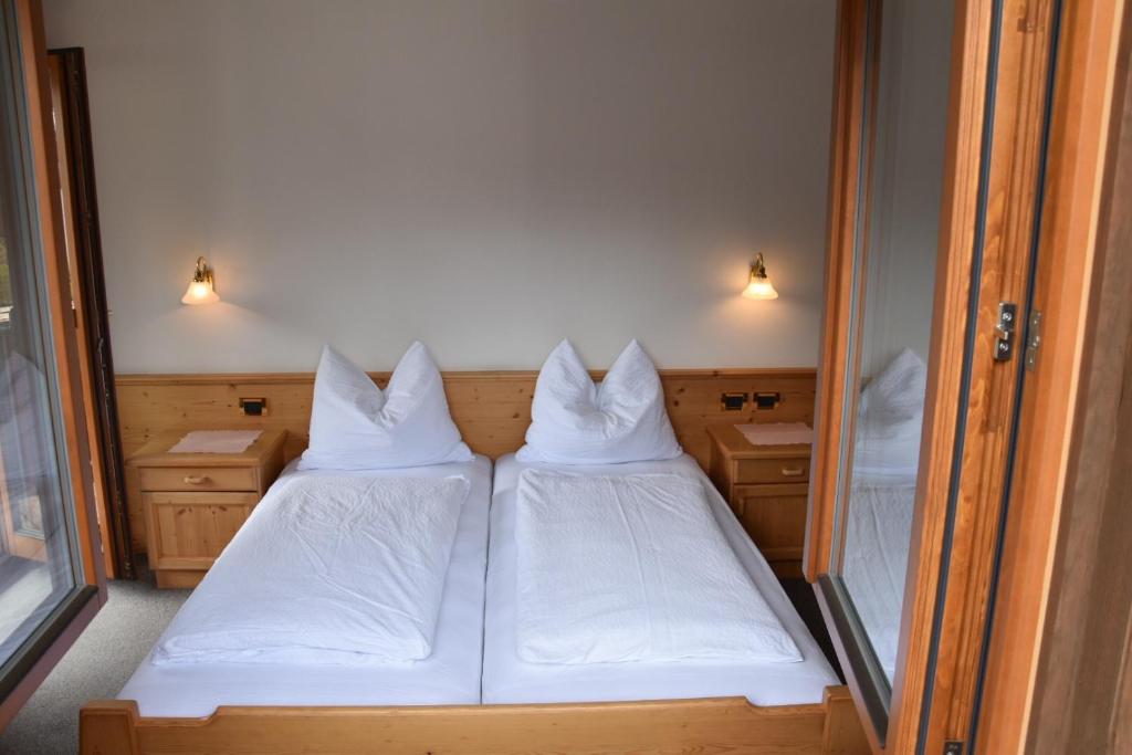 Postel nebo postele na pokoji v ubytování Garni Haus Tyrol