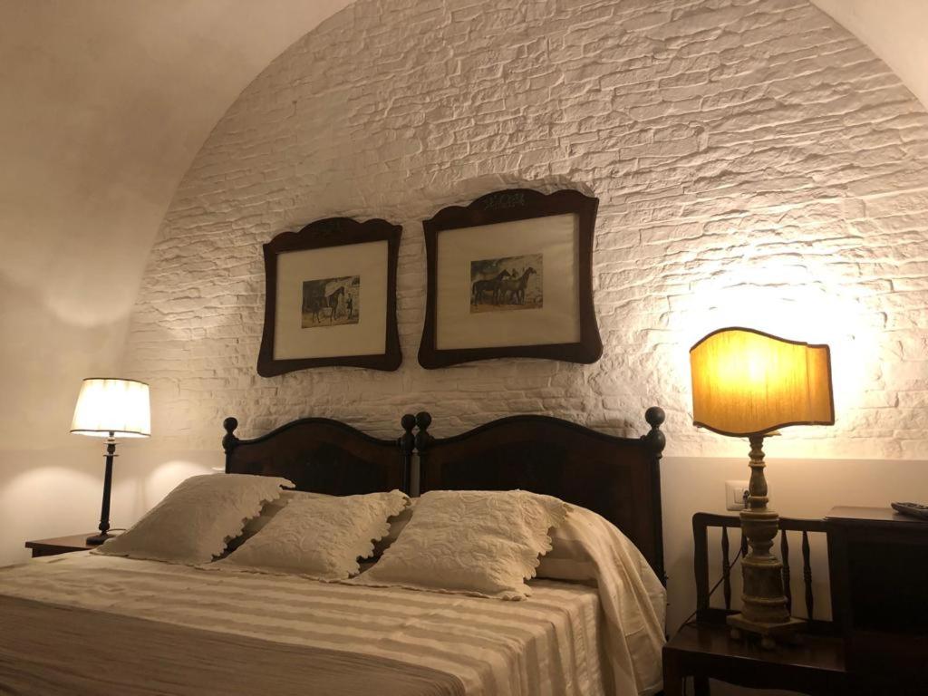 Postel nebo postele na pokoji v ubytování Le Stanze del Borgo