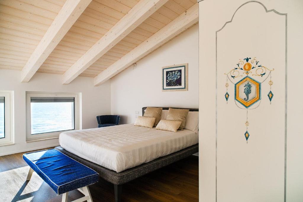 Postel nebo postele na pokoji v ubytování NUMA HOTEL