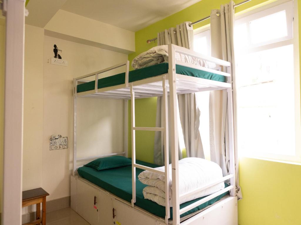 Postel nebo postele na pokoji v ubytování Tag Along Backpackers