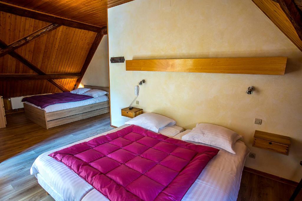 Postel nebo postele na pokoji v ubytování Le Bouton d'Or