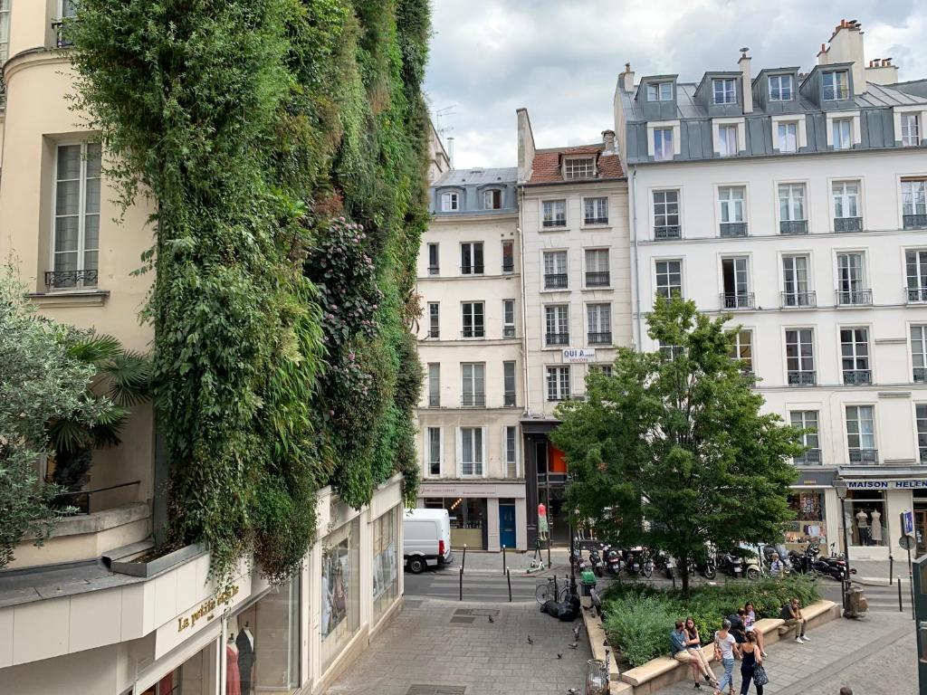 a street in a city with buildings at Artistic apartment center of Paris in Paris