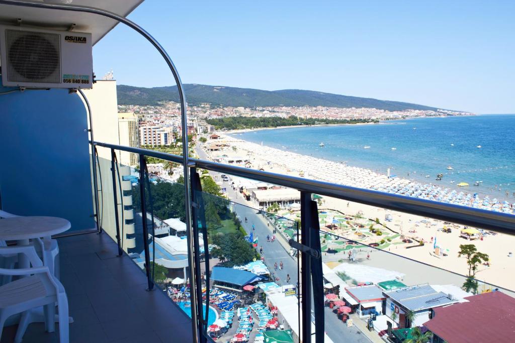 a balcony with a view of a beach and the ocean at Palace Hotel - Half Board in Sunny Beach