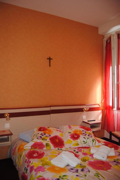Postel nebo postele na pokoji v ubytování Hôtel Myosotis