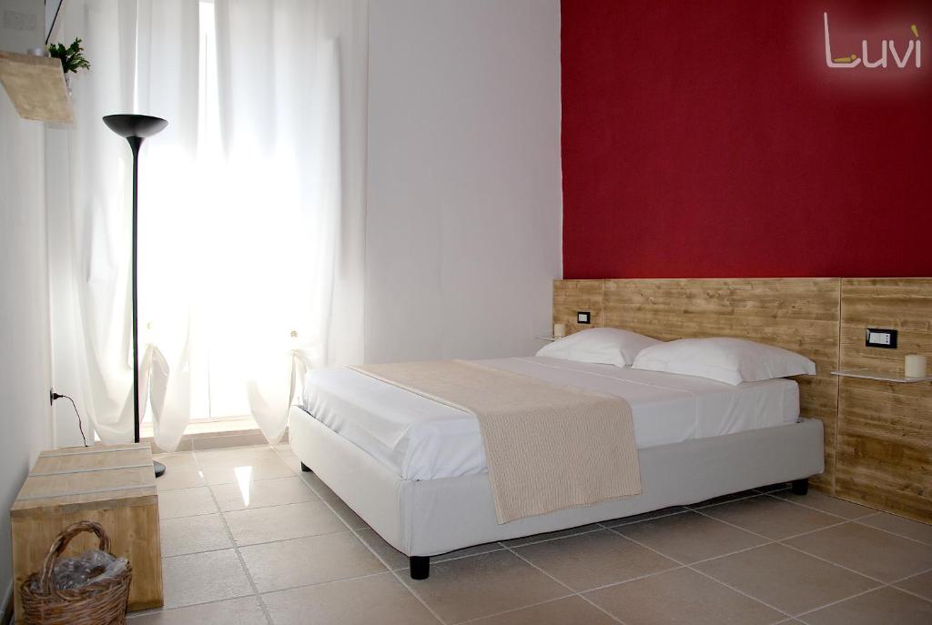 Postel nebo postele na pokoji v ubytování B&B Luvì