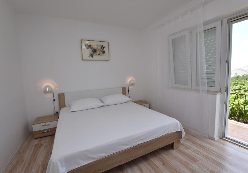 Posteľ alebo postele v izbe v ubytovaní Apartments Jere Proto