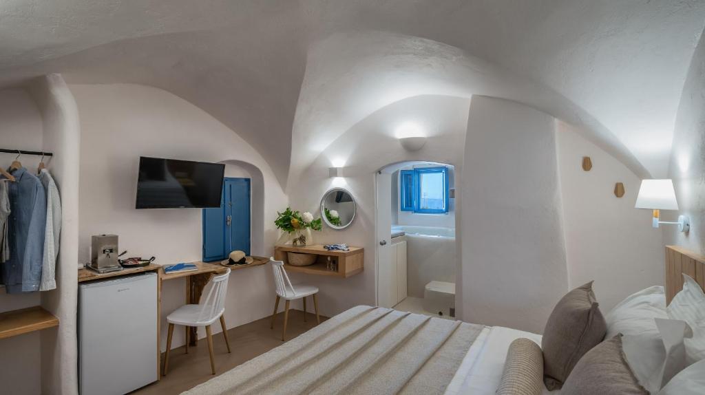 Postel nebo postele na pokoji v ubytování Nalas Suites