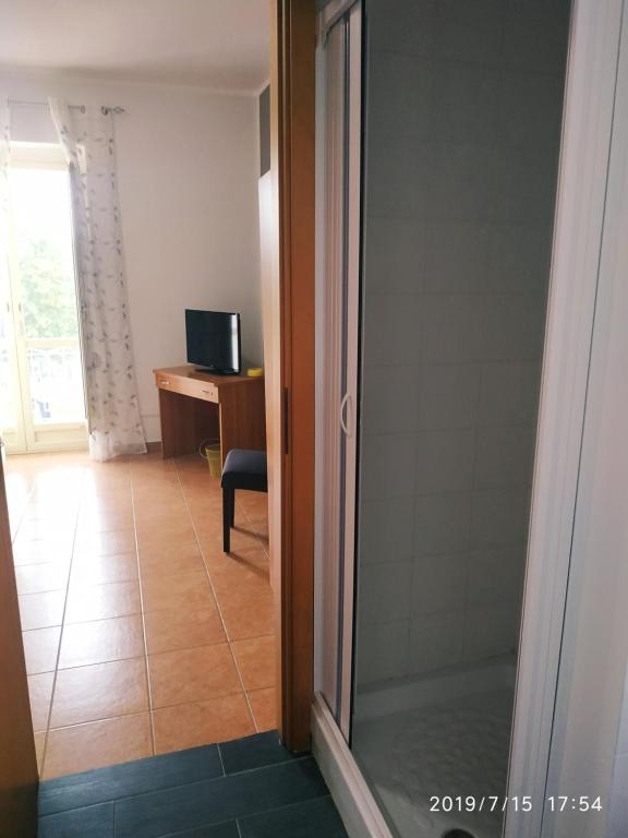 A television and/or entertainment centre at Santa e Maria Affittacamere