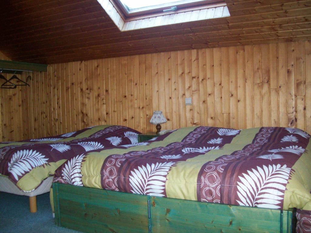 Postel nebo postele na pokoji v ubytování Hotel Les Sapins