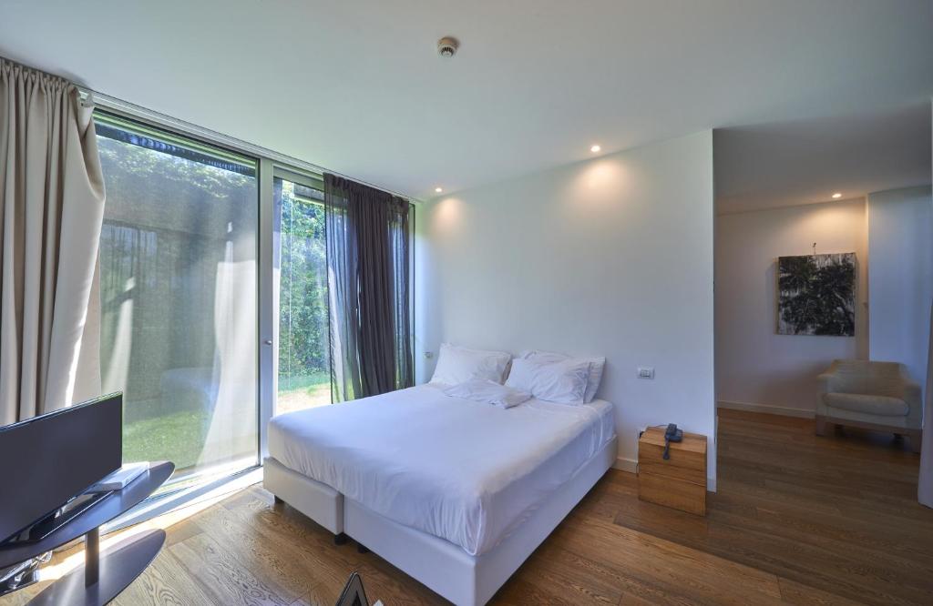 Postel nebo postele na pokoji v ubytování Casa Sull'Albero