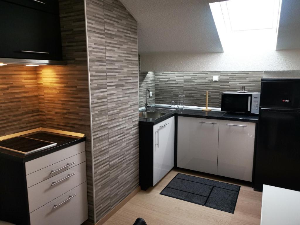 Kuchyň nebo kuchyňský kout v ubytování DB Bled Apartment
