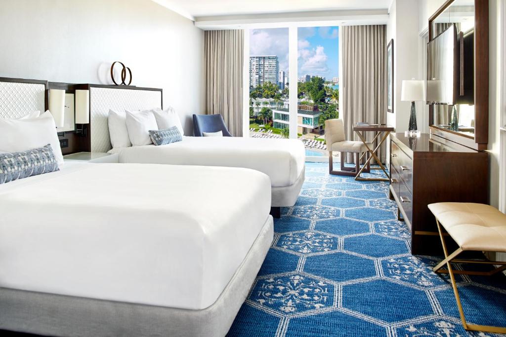 Postel nebo postele na pokoji v ubytování Fairmont El San Juan Hotel