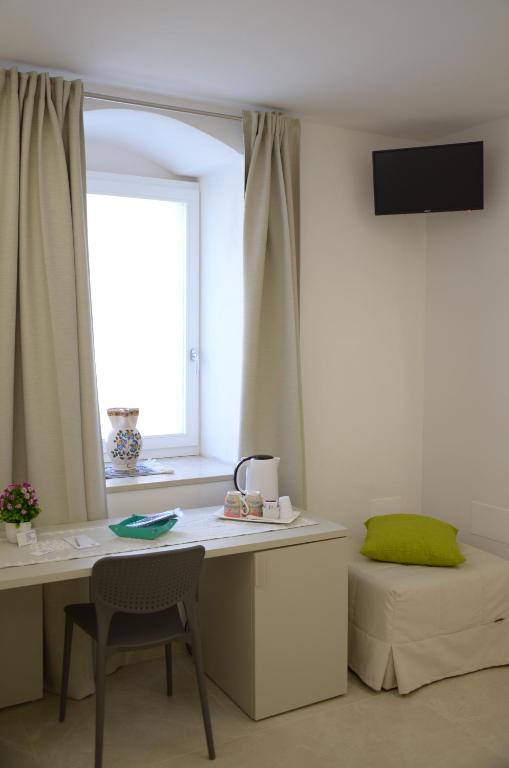 TV a/nebo společenská místnost v ubytování In & Out Matera