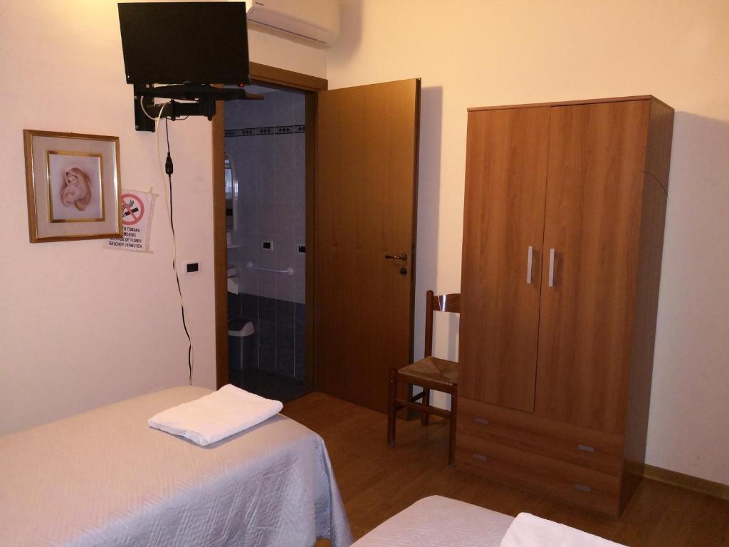 Postel nebo postele na pokoji v ubytování Trattoria Bar Oasi