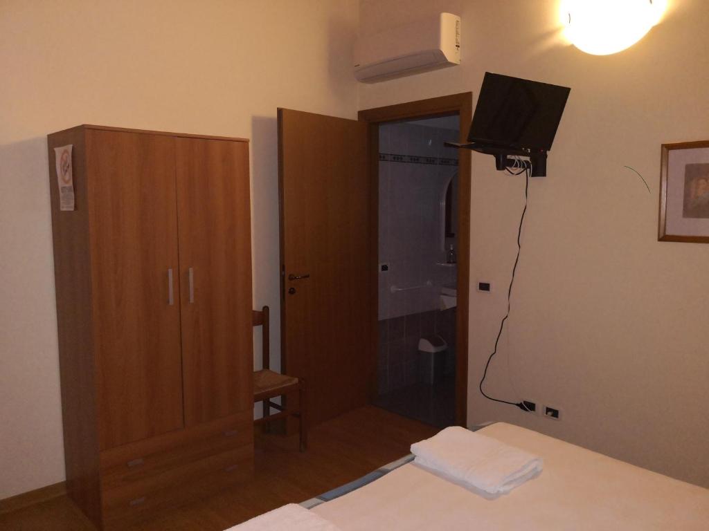 Postel nebo postele na pokoji v ubytování Trattoria Bar Oasi