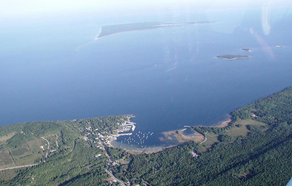 an aerial view of a large body of water at Harbor Guest House in Fish Creek