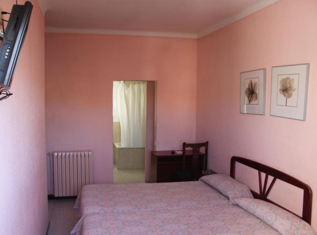 Postel nebo postele na pokoji v ubytování Hostal Solimar