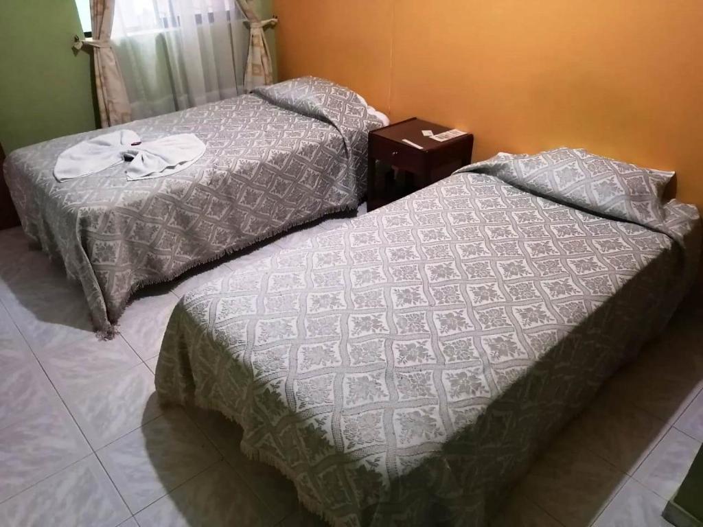 Postel nebo postele na pokoji v ubytování Hotel Marli Plaza