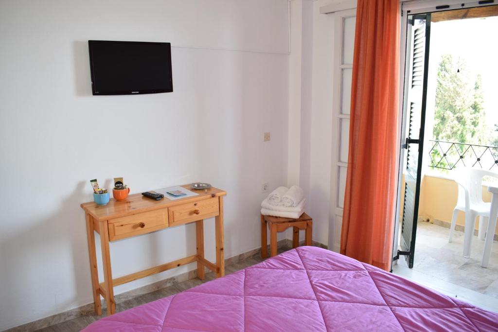 Postel nebo postele na pokoji v ubytování Rising Sun Apartments & Studios