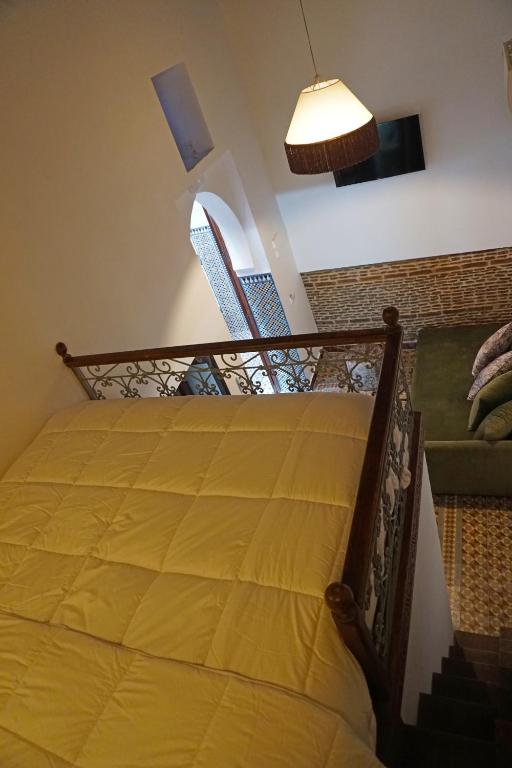 Una cama o camas en una habitación de Dar Fama