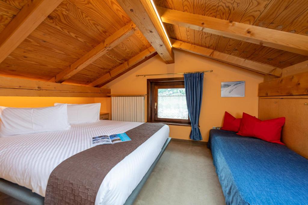 Łóżko lub łóżka w pokoju w obiekcie Chalet Rin Star