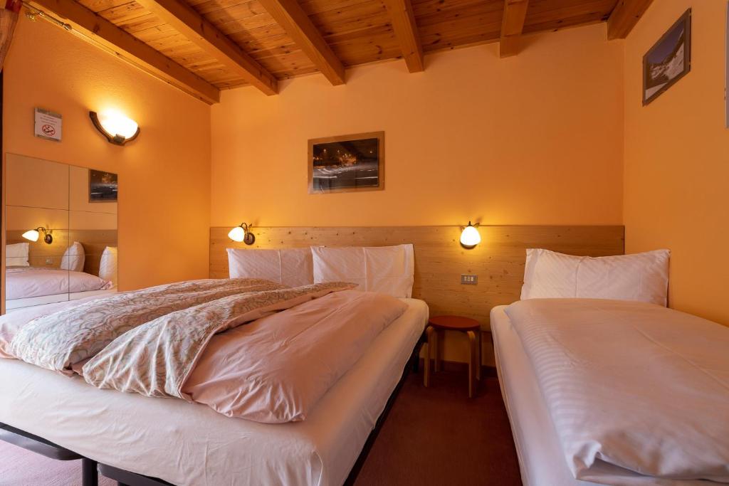 Łóżko lub łóżka w pokoju w obiekcie Chalet Rin Star