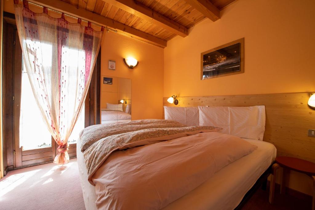 Łóżko lub łóżka w pokoju w obiekcie Chalet Rin Star