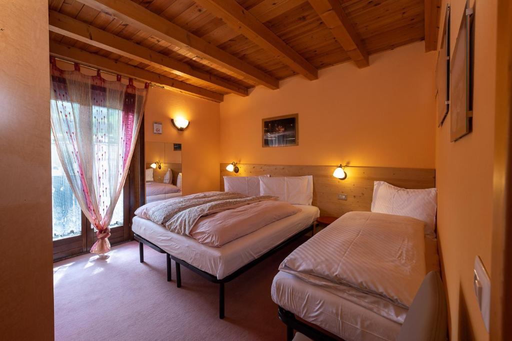 Łóżko lub łóżka w pokoju w obiekcie Chalet Rin Star
