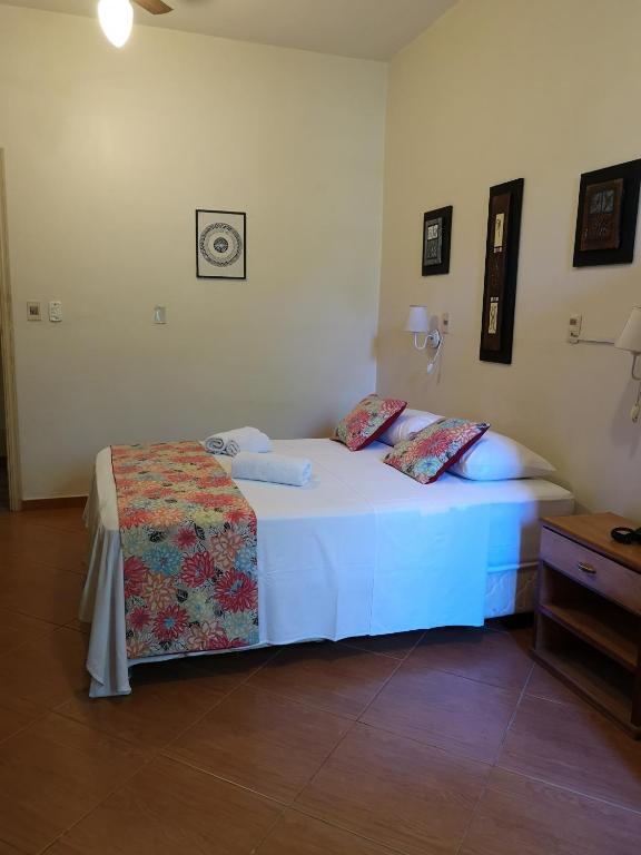 Postel nebo postele na pokoji v ubytování Las Orquideas Parque Hotel