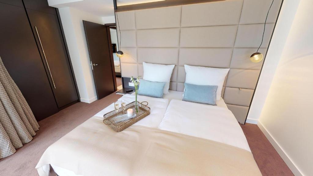 Postel nebo postele na pokoji v ubytování White Pearl Apartment 1.01