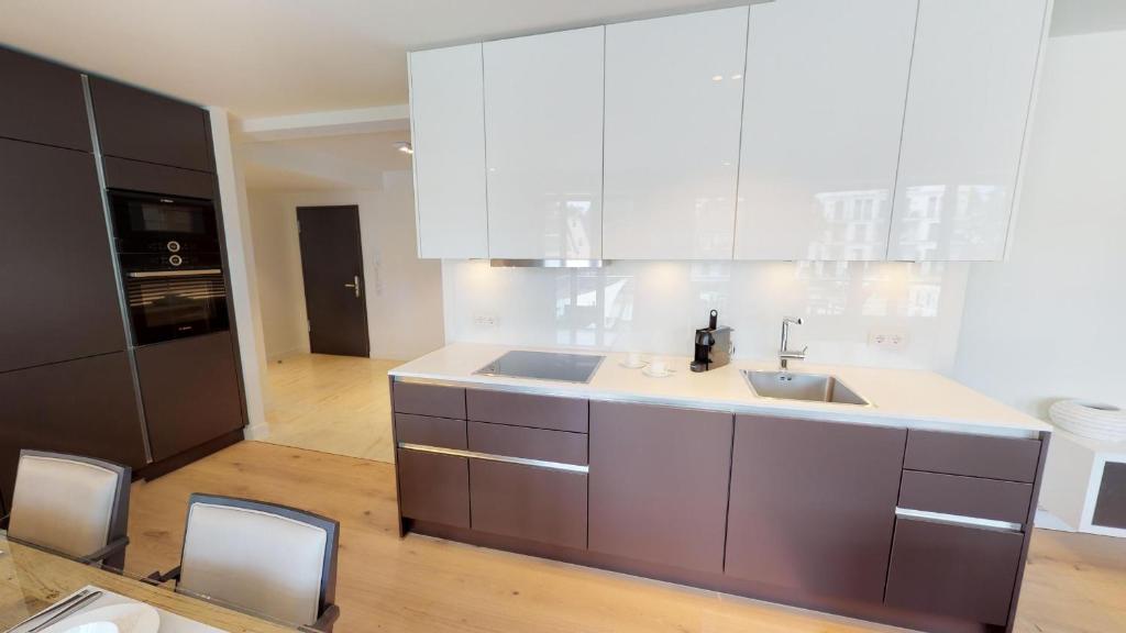 Kuchyň nebo kuchyňský kout v ubytování White Pearl Apartment 1.01