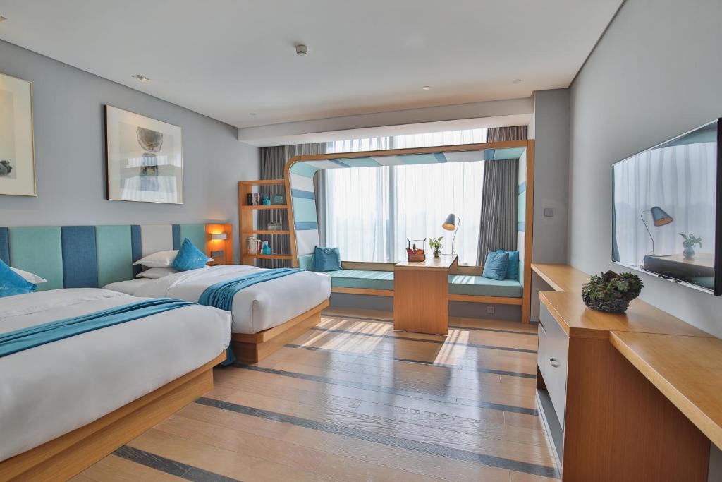 Postel nebo postele na pokoji v ubytování Shanghai Pagoda INNO Hotel