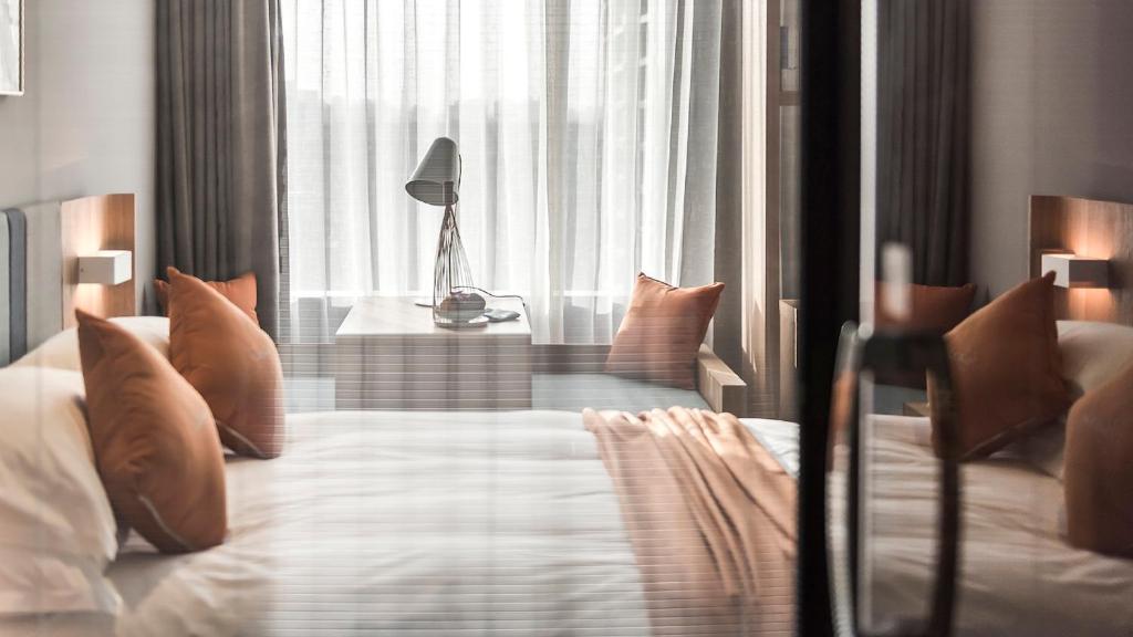 Postel nebo postele na pokoji v ubytování Shanghai Pagoda INNO Hotel