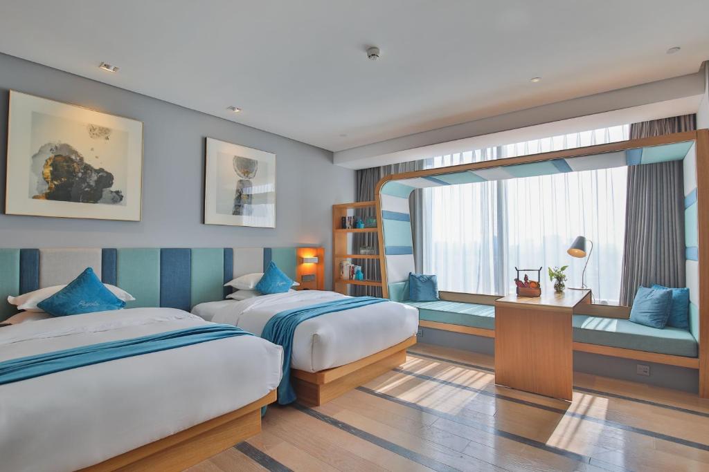 Postel nebo postele na pokoji v ubytování Shanghai Pagoda INNO Hotel