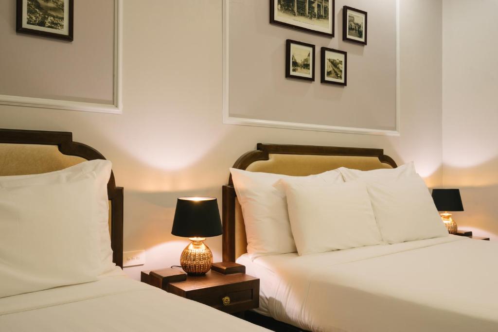 Postel nebo postele na pokoji v ubytování La Palm Hotel