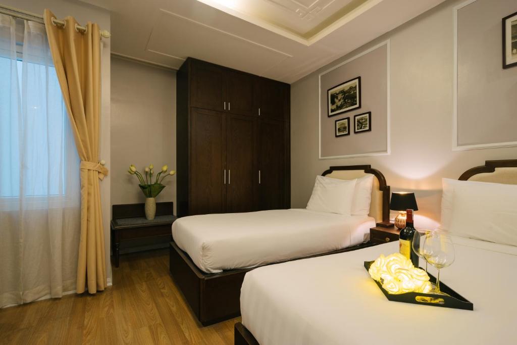 Postel nebo postele na pokoji v ubytování La Palm Hotel